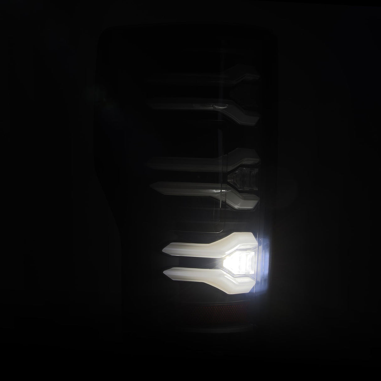 AlphaRex Luxx-Series LED tail lights in Black for 2017-2022 Ford Super Duty, installed view