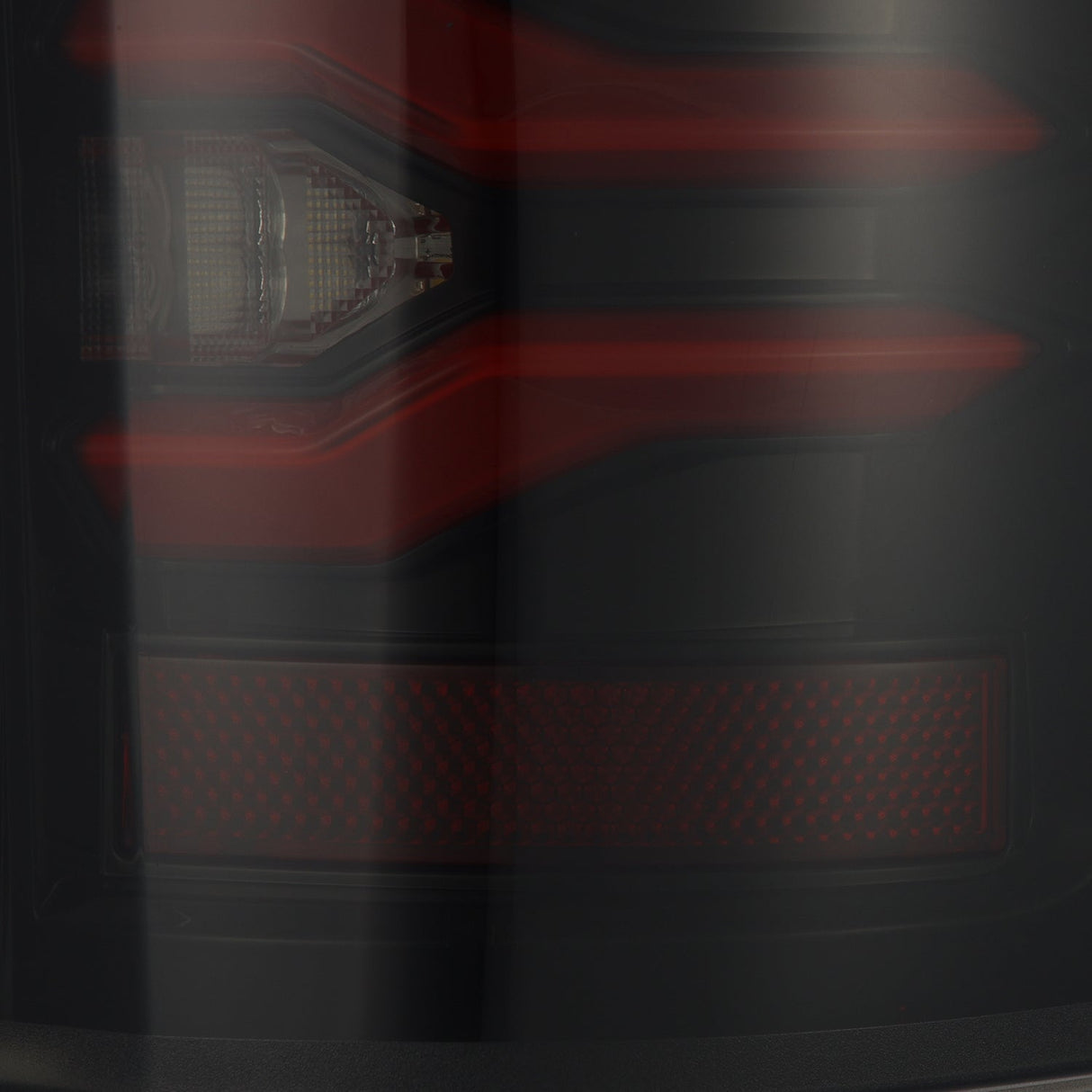 AlphaRex Luxx-Series LED tail lights in Black-Red for 2017-2022 Ford Super Duty, installed view