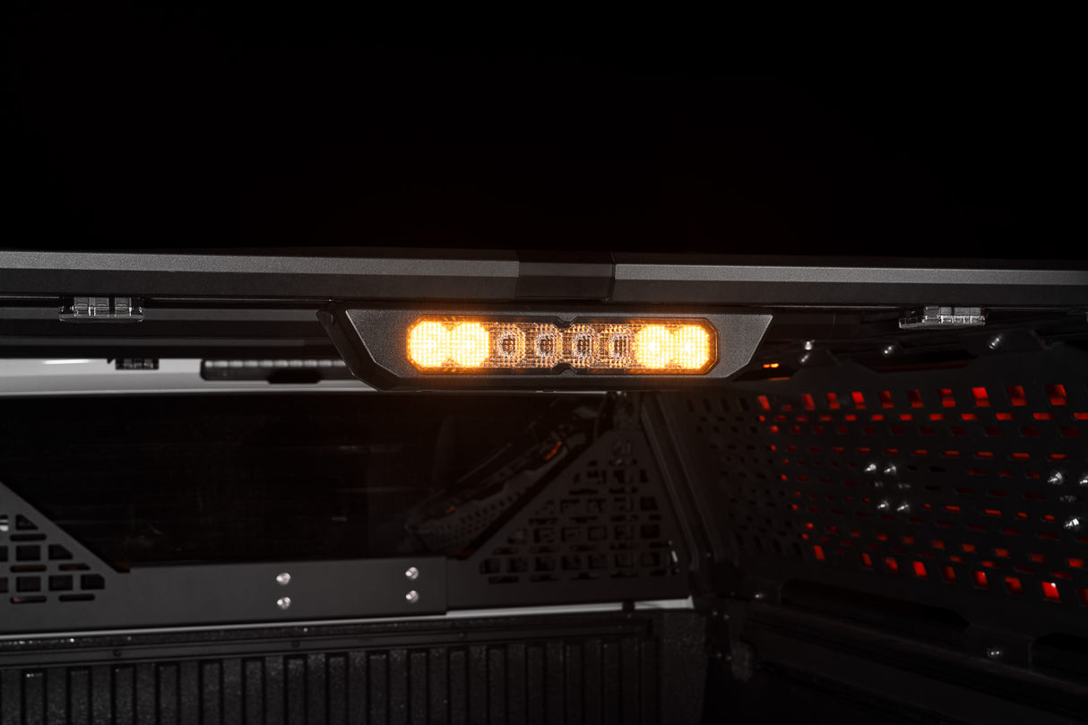 Diode Dynamics SS10 Chase Lightbar detail on the IBEX bed rack, amber lit