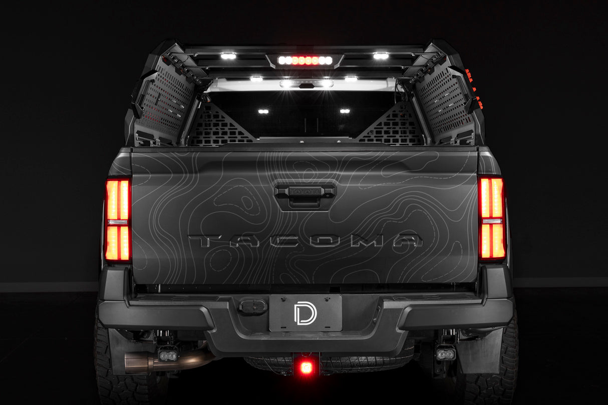 Diode Dynamics IBEX bed rack lighting kit installed on a Toyota Tacoma with bed lights, brake and reverse lit