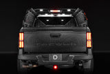 Diode Dynamics IBEX bed rack lighting kit installed on a Toyota Tacoma with bed lights, brake and reverse lit