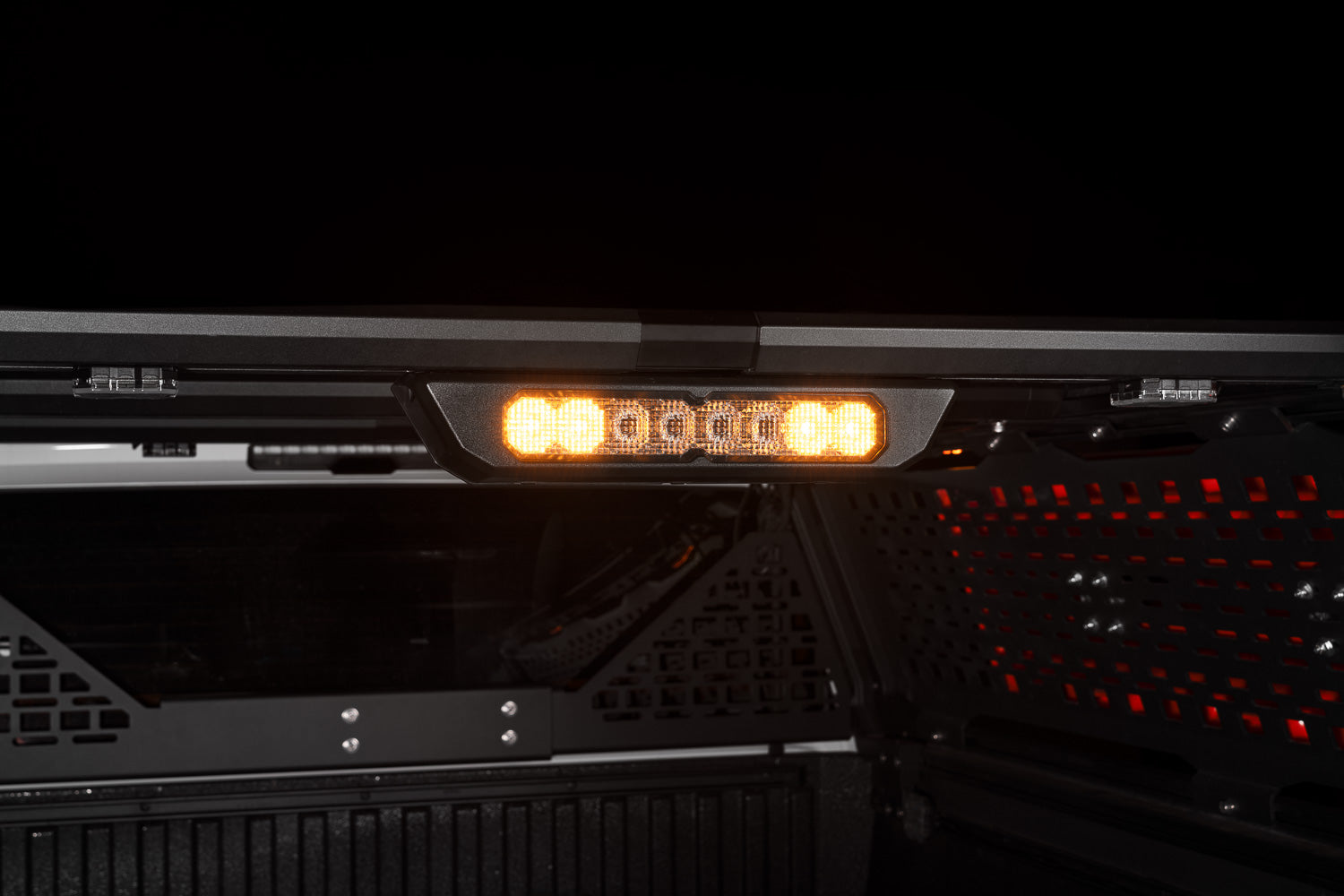 Diode Dynamics SS10 Chase Lightbar detail on the IBEX bed rack, amber lit