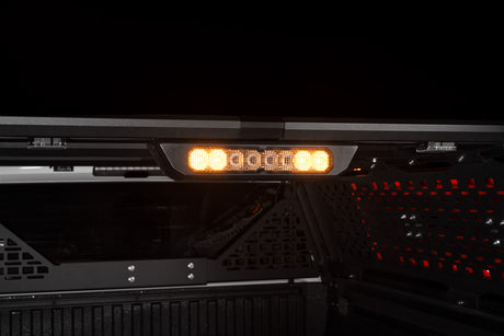 Diode Dynamics SS10 Chase Lightbar detail on the IBEX bed rack, amber lit