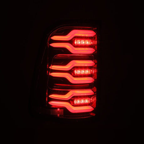 2019-2021 Ram 1500 Luxx-Series LED Tail Lights Alpha Black w Active Light Sequential Signal - View 4 | Dirty Garage